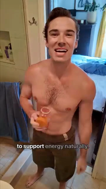 Sam Leicht smiling in a bathroom doorway, holding an Emergen-C drink